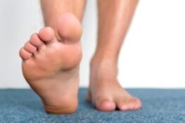 bare foot is walking on the carpet