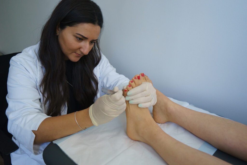 Doctor treat the patient's foot