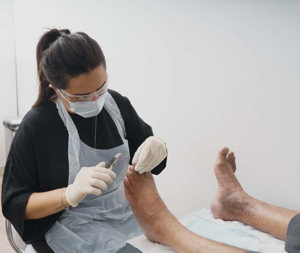 Doctor is taking care of patient feet