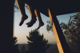 Sun reflect it's light on 3 people's feet